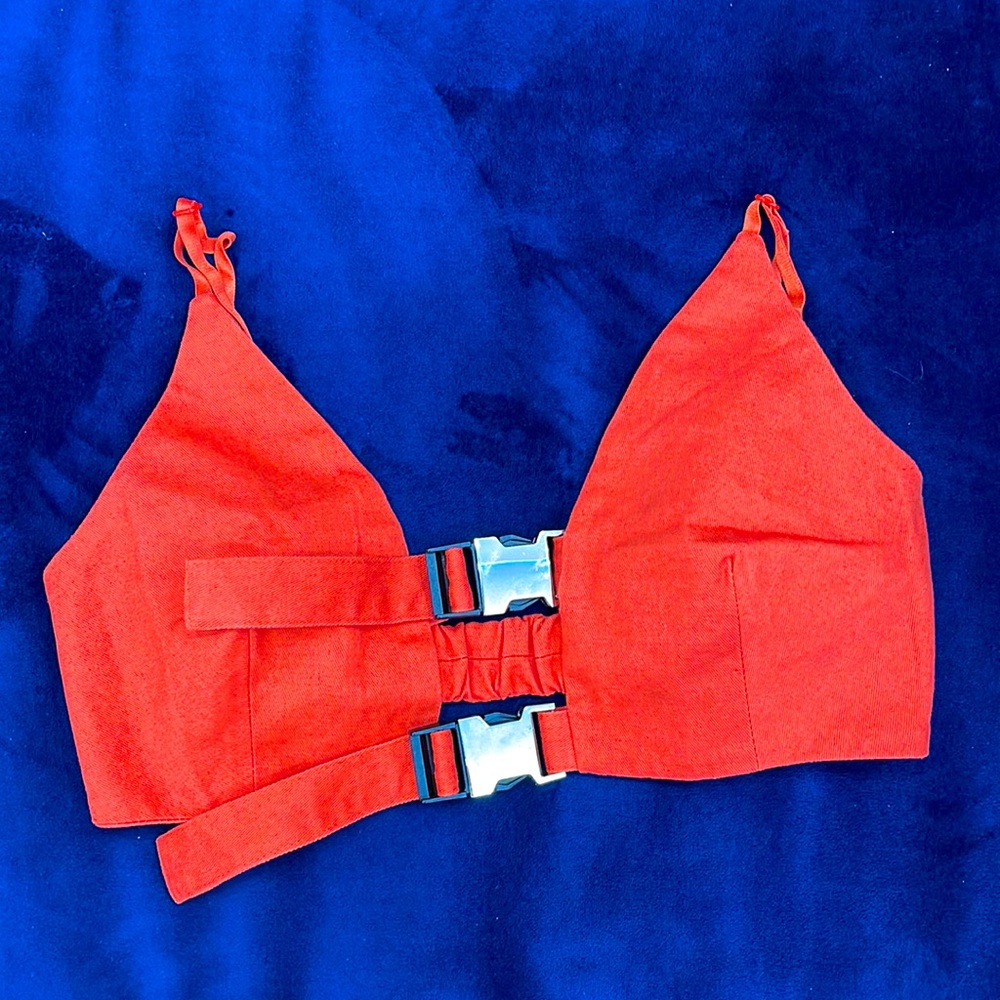 This is a crop top, brand new, never worn, color orange.